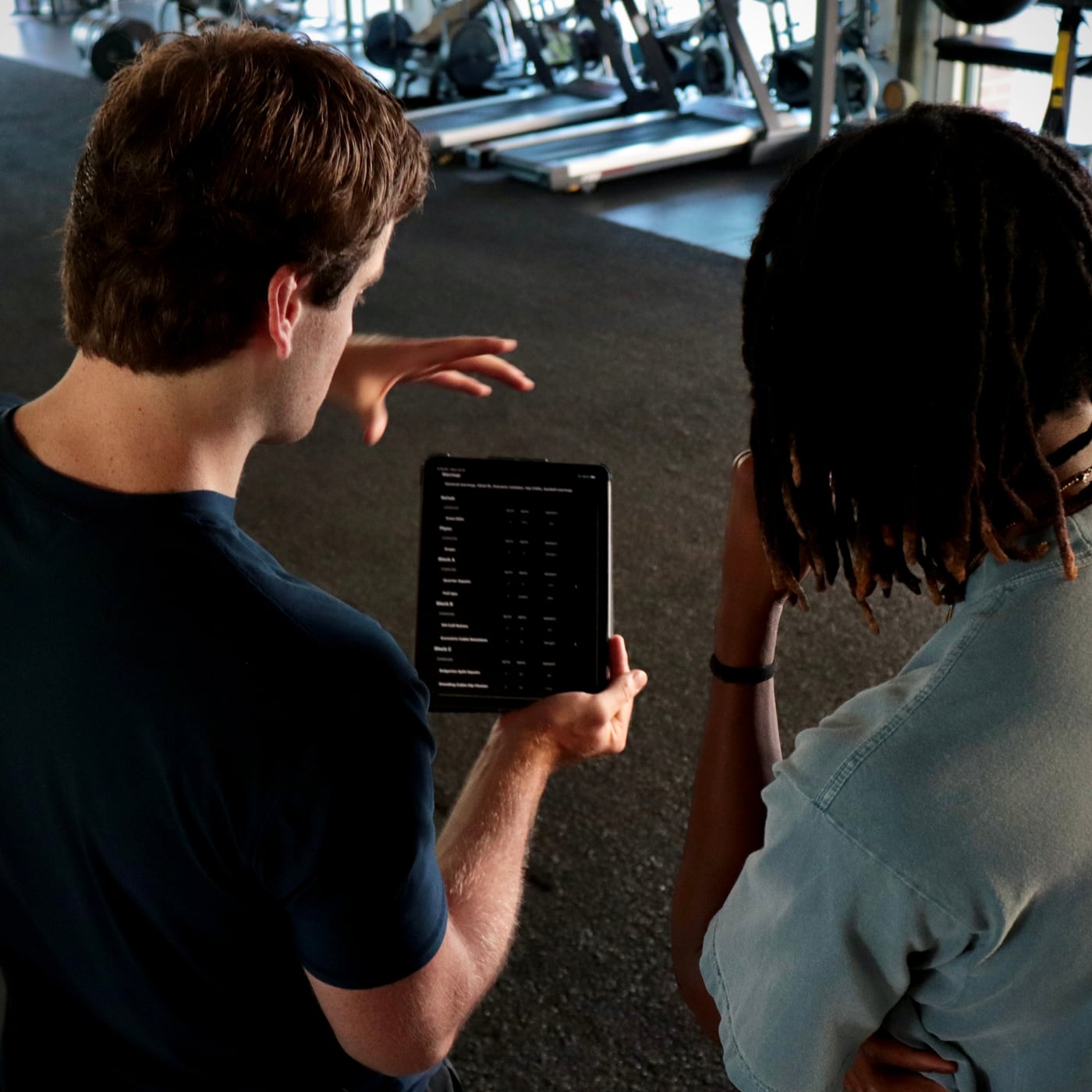 Coach reviewing training plan with an athlete